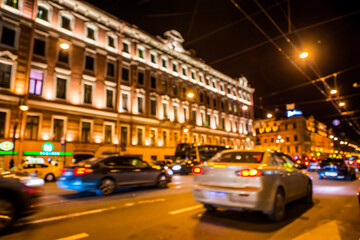 Fototapeta na wymiar Nights lights of the big city, rush hour in the city. Wide-angle view, defocused image