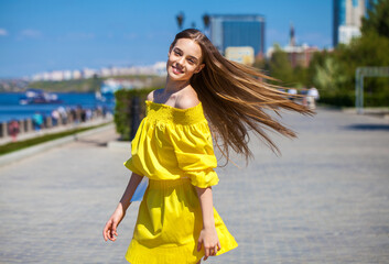 Young beautiful tennager girl in yellow dress