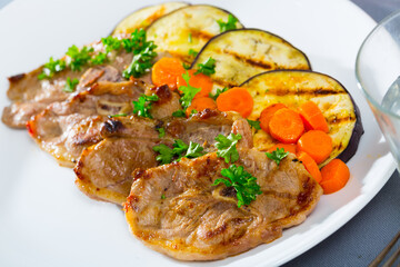 Barbecued lamb chops served with grilled aubergine and carrot
