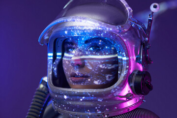 Portrait of female astronaut in studio with illumination