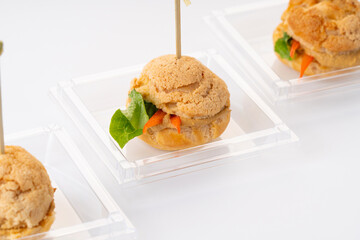 veggie profiteroles with vegetables and lettuce. Catering. On a white background