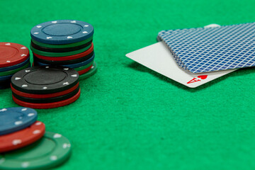 Gambling chips on computer keyboard on green background