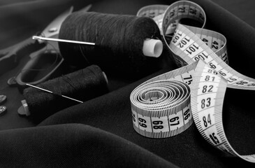Needle and thread, scissors, sewing machine. Tailor's, fashion designer's, and seamstress's tools....