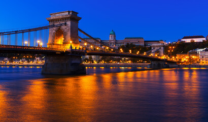 Fototapeta premium Night light of Chain Bridge near Buda Fortress is hungarian landmark outdoors.