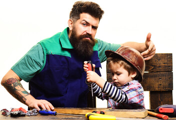 Repair and assistance concept. Father and son repairing together. Children's creativity and engineering education.