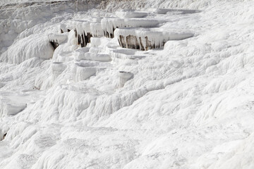 Fototapeta na wymiar white magic in Pamukkale - limestone travertine formations pools with mineral water from hot springs