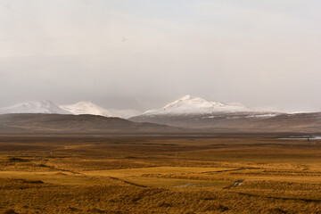 Iceland's off-road, Snow-capped mountains against the backdrop of meadows - 436388184