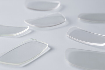 Many of glasses for eyeglasses for vision on a pastel background.