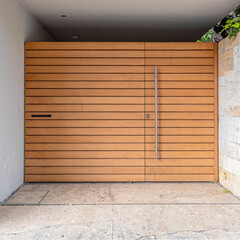 simple modern house front external wooden door by the sidewalk, Athens Greece