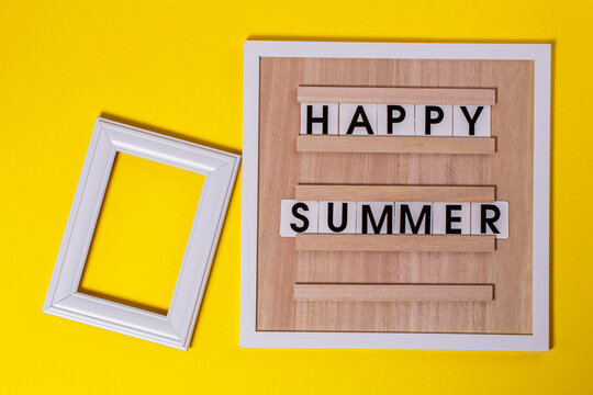 A composition with a white photo frame and a message board with a quote about a happy summer.