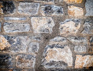 rough stone wall closeup, seamless pattern textured background, filtered image