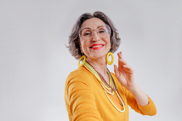 Happy senior woman making selfie on smartphone