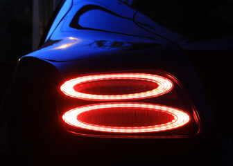 car detail, red car rear lights at night