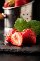 Fresh strawberries on dark background - 436391582