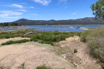Fototapeta na wymiar Drought Stricken California Low water Levels on Big Bear Lake showing the Consequences of Climate Change and how it affects local Economy