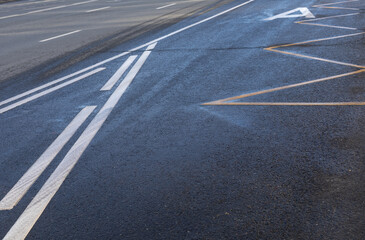 Road markings on the asphalt. Public transport stop zone and intermittent white line