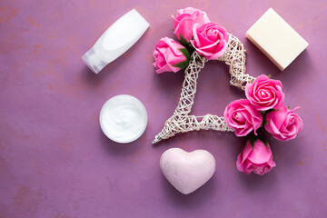 Natural spa set with cream and soap and soap roses on a pink background. Valentine's Day, birthday, mother's day, 8 March. Top view, flat lay.