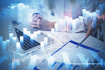 Two business people traders working together to develop new trading strategy. Stock market changes, business graph chart. Overlay. Concept of internet trading