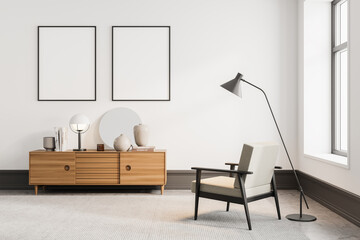Minimalistic white living room interior with bookshelf and two vertical posters