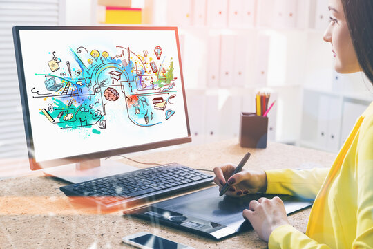 Over the shoulder shot of attractive woman graphic designer draw