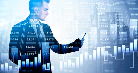 Handsome businessman with smartphone in hands analysing stock market changes, double exposure of city buildings. Concept of online trading
