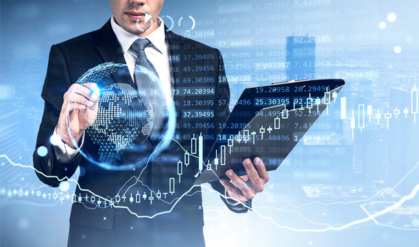 Businessman with clipboard and pen touch earth globe and candlesticks