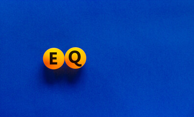 EQ, emotional quotient symbol. Orange table tennis balls with words 'EQ - emotional quotient'....