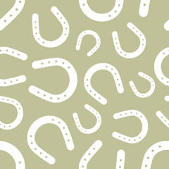 White horseshoe seamless pattern on beige background. Vector illustration.