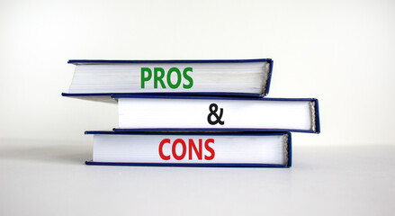 Pros and cons symbol. Books with words 'Pros and cons'. Beautiful white background. Business, pros and cons concept, copy space.