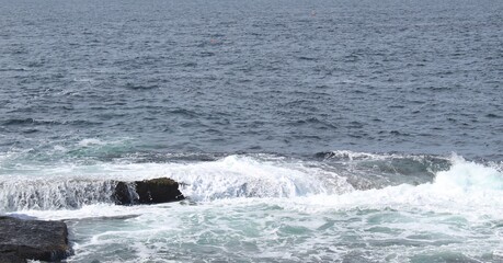 waves rolling on rocky coastline