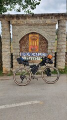 bicycle in front of a brick wall
