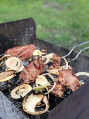 Beef steaks on the grill with flames