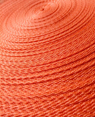 Orange abstract background. Circular pattern of orange sling