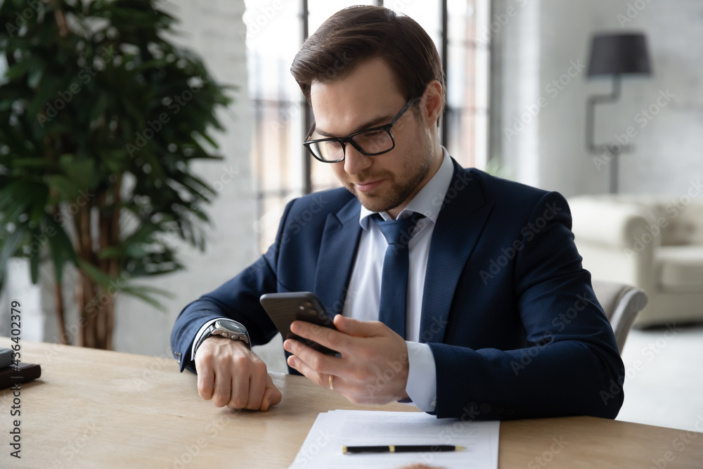 Sticker punctual business leader checking time on wrist watch and smartphone. businessman, manager waiting i