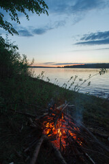 Bonfire by the river in summer.