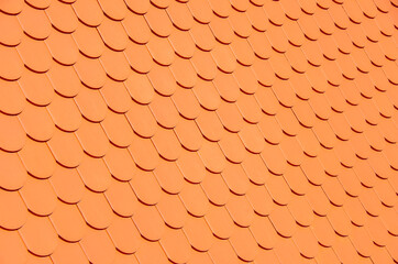 Orange fish scalc roof as a texture or background