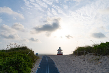 Smooth pathway across dunes to South Beach of Miami city in Florida, USA
