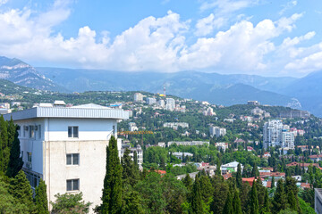 Obraz premium Urban landscape with views of buildings and mountains. Yalta