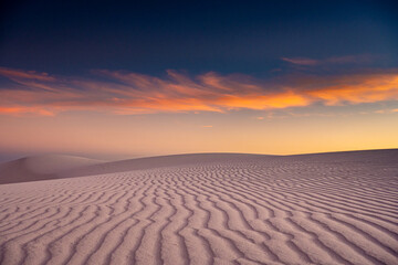 Fototapeta na wymiar Orange and Blue Skies Over White Sand Dune Lines