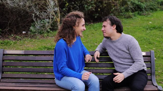 pushy friend - man talking to a girl is excluded when a pushy friend arrives 