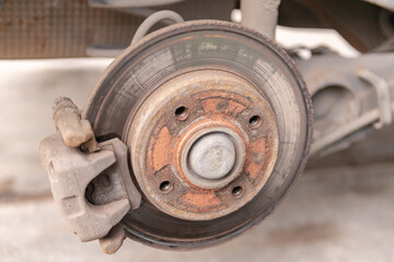 Old car brake disc. The brakes on the car require regular maintenance. Very close-up of the brake...