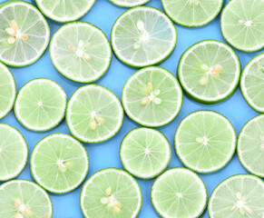 Limes with slices isolated on white background.