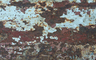 image of rusty on the surface of an old iron plate. The old material was eaten by rust, causing many damage to the surface.