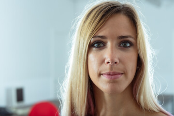 Close up headshot of an attractive mature blond woman