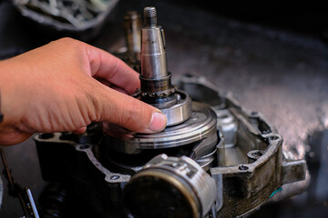 Close-up of the new engine connecting rod of a motorcycle.
