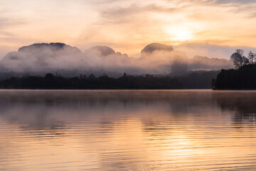 Ban Nong Thale the natural scenery of the sunshine in the morning (mountains, lakes, trees, fog), Thailand.