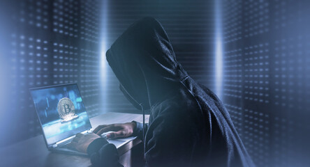 Cybercrime hacking and technology crime with laptop display show bitcoin icon in the server room