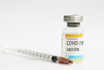 COVID-19 vaccine concept with white background and syringe injection, protective from novel coronavirus 2019.COVID-19 vaccine concept with white background and syringe injection, protective from novel