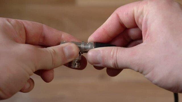 Connecting sdi cable to bnc tee close up