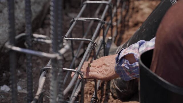 Meachanical annealing wire steel binding wall building outdoor construction site close up